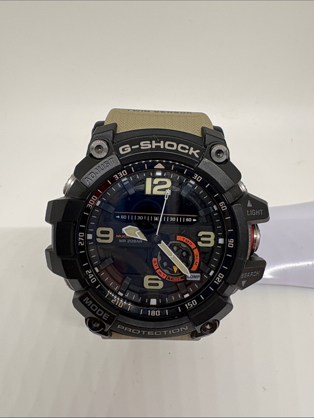 G-Shock Black Case with Tan Strap and Orange Dial Accent